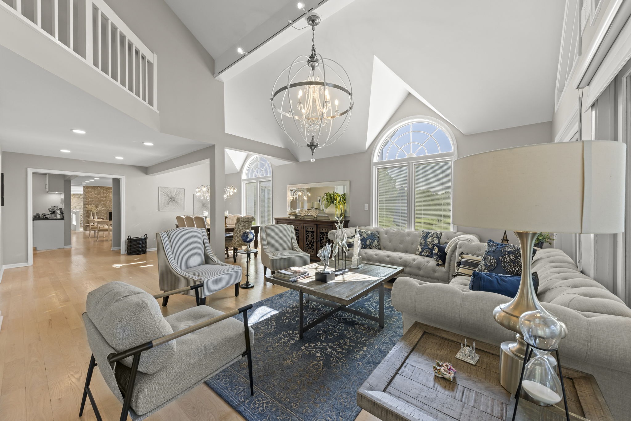 Naperville homes for sale with tennis court at 23W735 Hobson Rd featuring a fully renovated regulation tennis and pickleball court with basketball hoops and spectator patio