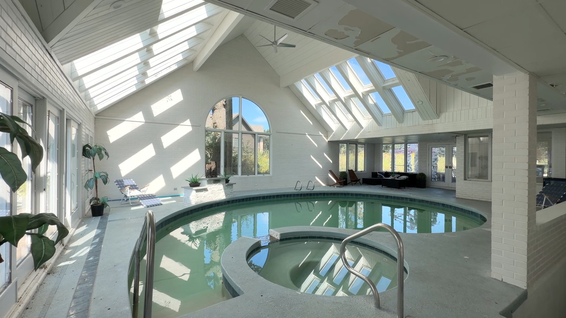 Naperville homes with indoor pool featuring 23W735 Hobson Rd heated swimming pool and whirlpool spa with vaulted cedar ceilings and skylights in District 203